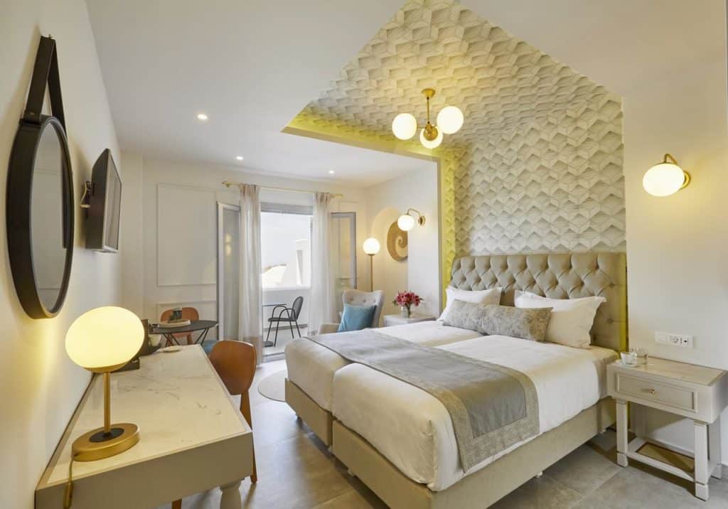Cama de casal em quarto do De Sol Hotel e Spa